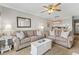 Open living space features comfortable seating, carpeting and neutral coastal decor at 824 N Waccamaw Dr. # 203, Murrells Inlet, SC 29576