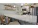 Bright kitchen with white quartz countertops, stainless steel appliances, and pendant lighting at 88 Salt Marsh Circle # 22F, Pawleys Island, SC 29585