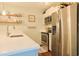 Updated kitchen with stainless steel appliances, quartz countertops and wood floating shelves at 88 Salt Marsh Circle # 22F, Pawleys Island, SC 29585