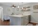 Modern kitchen island with a breakfast bar, granite countertops, and stainless steel appliances at 88 Salt Marsh Circle # 22F, Pawleys Island, SC 29585