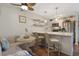 Charming eat-in kitchen featuring stainless steel appliances, a breakfast bar, and seating area for casual dining at 88 Salt Marsh Circle # 22F, Pawleys Island, SC 29585