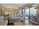 Charming living room with a view of the patio featuring hardwood floors and comfortable seating at 88 Salt Marsh Circle # 22F, Pawleys Island, SC 29585