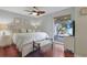 Comfortable main bedroom features a large window, wood floors, and a king-size bed for a relaxing retreat at 88 Salt Marsh Circle # 22F, Pawleys Island, SC 29585