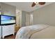 Well-lit main bedroom featuring wood floors showcases a coastal theme with a view into the bathroom at 88 Salt Marsh Circle # 22F, Pawleys Island, SC 29585