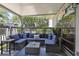 Cozy covered patio with comfortable wicker furniture and a coffee table perfect for outdoor relaxation at 88 Salt Marsh Circle # 22F, Pawleys Island, SC 29585