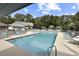 Community pool with ample seating, trees and surrounding neighborhood at 88 Salt Marsh Circle # 22F, Pawleys Island, SC 29585