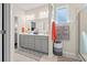 Bathroom featuring double sink vanity, gray cabinets, framed mirror, and walk-in shower at 915 Sorano St., Myrtle Beach, SC 29579