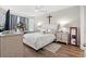 Cozy bedroom with hardwood floors, a ceiling fan, and bright, natural light at 915 Sorano St., Myrtle Beach, SC 29579