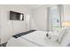 Relaxing bedroom with white comforter set, gray accents, and bright natural light at 915 Sorano St., Myrtle Beach, SC 29579