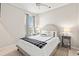 Cozy bedroom with plush bed, neutral tones, and natural light from a window at 915 Sorano St., Myrtle Beach, SC 29579