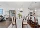 Bright dining room with a view to the kitchen and glass display cabinet at 915 Sorano St., Myrtle Beach, SC 29579