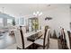 Bright dining room featuring a glass table, seating for eight, and modern chandelier at 915 Sorano St., Myrtle Beach, SC 29579