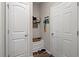 Hallway with white doors, coat storage and built-in bench, with stylish decor at 915 Sorano St., Myrtle Beach, SC 29579
