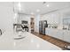 Bright kitchen featuring a large island with a sink, stainless steel appliances, and pendant lighting at 915 Sorano St., Myrtle Beach, SC 29579