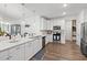 Bright kitchen featuring white cabinetry, stainless appliances, and an island with pendant lighting at 915 Sorano St., Myrtle Beach, SC 29579