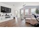 Bright living room featuring hardwood floors, a ceiling fan, and comfortable seating at 915 Sorano St., Myrtle Beach, SC 29579