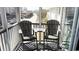 Relax on the balcony with two Adirondack chairs, small table, and partial city views at 9571 Shore Dr. # 318, Myrtle Beach, SC 29572