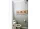 Small bathroom with pale aqua walls and fish decor above the toilet at 9571 Shore Dr. # 318, Myrtle Beach, SC 29572