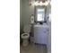 Small bathroom with an open toilet and sink cabinet at 9571 Shore Dr. # 318, Myrtle Beach, SC 29572