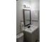 Bathroom with a square mirror, towel bar, and a white and gray wood grain vanity at 9571 Shore Dr. # 318, Myrtle Beach, SC 29572