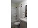 Well lit bathroom with a shower/tub combo, with a neutral colored cabinet and brushed nickel fixtures at 9571 Shore Dr. # 318, Myrtle Beach, SC 29572