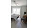 Bright bedroom with light-colored wood flooring, a ceiling fan, and a sliding glass door at 9571 Shore Dr. # 318, Myrtle Beach, SC 29572