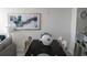 Dining area with elegant decor, a decorative fish centerpiece, and a seamless flow into the modern kitchen and living area at 9571 Shore Dr. # 318, Myrtle Beach, SC 29572