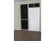 Condo entryway with a white louvered door, screen window, and a unit number; creates a clean and inviting access point at 9571 Shore Dr. # 318, Myrtle Beach, SC 29572