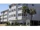 Exterior view of Pelican's Watch with lush landscaping and balcony views at 9571 Shore Dr. # 318, Myrtle Beach, SC 29572