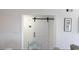 Interior view featuring a white sliding barn door, and white wainscoting at 9571 Shore Dr. # 318, Myrtle Beach, SC 29572
