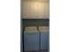 Convenient laundry room with overhead cabinets maximizing storage space and organization at 9571 Shore Dr. # 318, Myrtle Beach, SC 29572