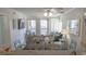 Inviting living and dining area featuring coastal decor, a large dining table, and a balcony view at 9571 Shore Dr. # 318, Myrtle Beach, SC 29572
