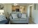 Cozy living room showcases comfortable seating and stylish coastal decor with a pass through to the kitchen at 9571 Shore Dr. # 318, Myrtle Beach, SC 29572
