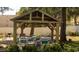 Charming outdoor seating area with shade and grill, ideal for entertaining guests at 9571 Shore Dr. # 318, Myrtle Beach, SC 29572