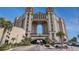 View of the building exterior showing elegant architecture, grand entrance, and lush tropical landscaping at 100 North Beach Blvd. # 710, North Myrtle Beach, SC 29582