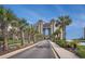 Scenic exterior view of the building with palm trees lining the street at 100 North Beach Blvd. # 710, North Myrtle Beach, SC 29582