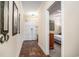 Neutral hallway featuring tile floors, a decorative mirror, and a bedroom entrance at 100 North Beach Blvd. # 710, North Myrtle Beach, SC 29582