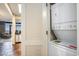 A functional laundry area with a stacked washer and dryer unit located in the hallway at 100 North Beach Blvd. # 710, North Myrtle Beach, SC 29582