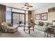 Bright living room with a seating area, balcony access, and views of the building's exterior at 100 North Beach Blvd. # 710, North Myrtle Beach, SC 29582