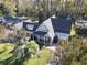 Aerial view of a residence with a covered porch, landscaped yard, and an attached garage at 1044 Martin Ln., Conway, SC 29526