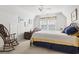 Bedroom with vaulted ceilings featuring a wooden bed frame and a rocking chair at 1044 Martin Ln., Conway, SC 29526