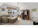 An office/bedroom space includes a comfortable chair, an ottoman, and a built in desk at 1044 Martin Ln., Conway, SC 29526