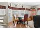 Sunlit breakfast nook with large windows, a glass table, and three chairs at 1044 Martin Ln., Conway, SC 29526