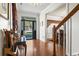 Bright entryway featuring hardwood floors, a decorative front door, and staircase to the right at 1044 Martin Ln., Conway, SC 29526