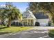 Charming one-story home with a well-manicured lawn and a beautiful palm tree at 1044 Martin Ln., Conway, SC 29526