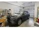 Attached garage with storage shelves, work bench and an SUV parked inside at 1044 Martin Ln., Conway, SC 29526