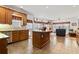 Open kitchen featuring custom wood cabinets, an island, and stainless steel appliances at 1044 Martin Ln., Conway, SC 29526