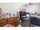 Laundry room area with storage cabinets, counter, shelving, and gray front load washer and dryer at 1044 Martin Ln., Conway, SC 29526