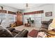 Cozy living room with comfortable seating, an entertainment center, and natural light at 1044 Martin Ln., Conway, SC 29526