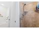 Modern tiled walk-in shower with a handheld shower head and built in shelf at 1044 Martin Ln., Conway, SC 29526